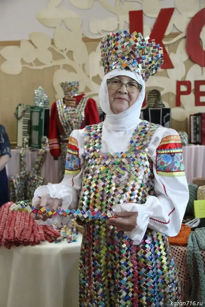 The female residents of the settlement of Karmalka in Zainsky District create unique costumes from candy wrappers.