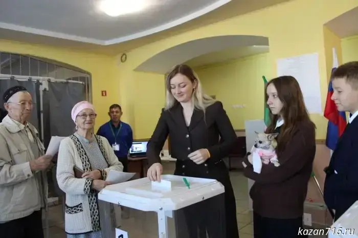 The whole family — and their furry friend: four generations of the Gabsalikovs went to the polls.
